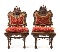 A Pair of Portuguese Carved and Parcel Giltwood Hall Chairs, Height 48 1/2 inches.
