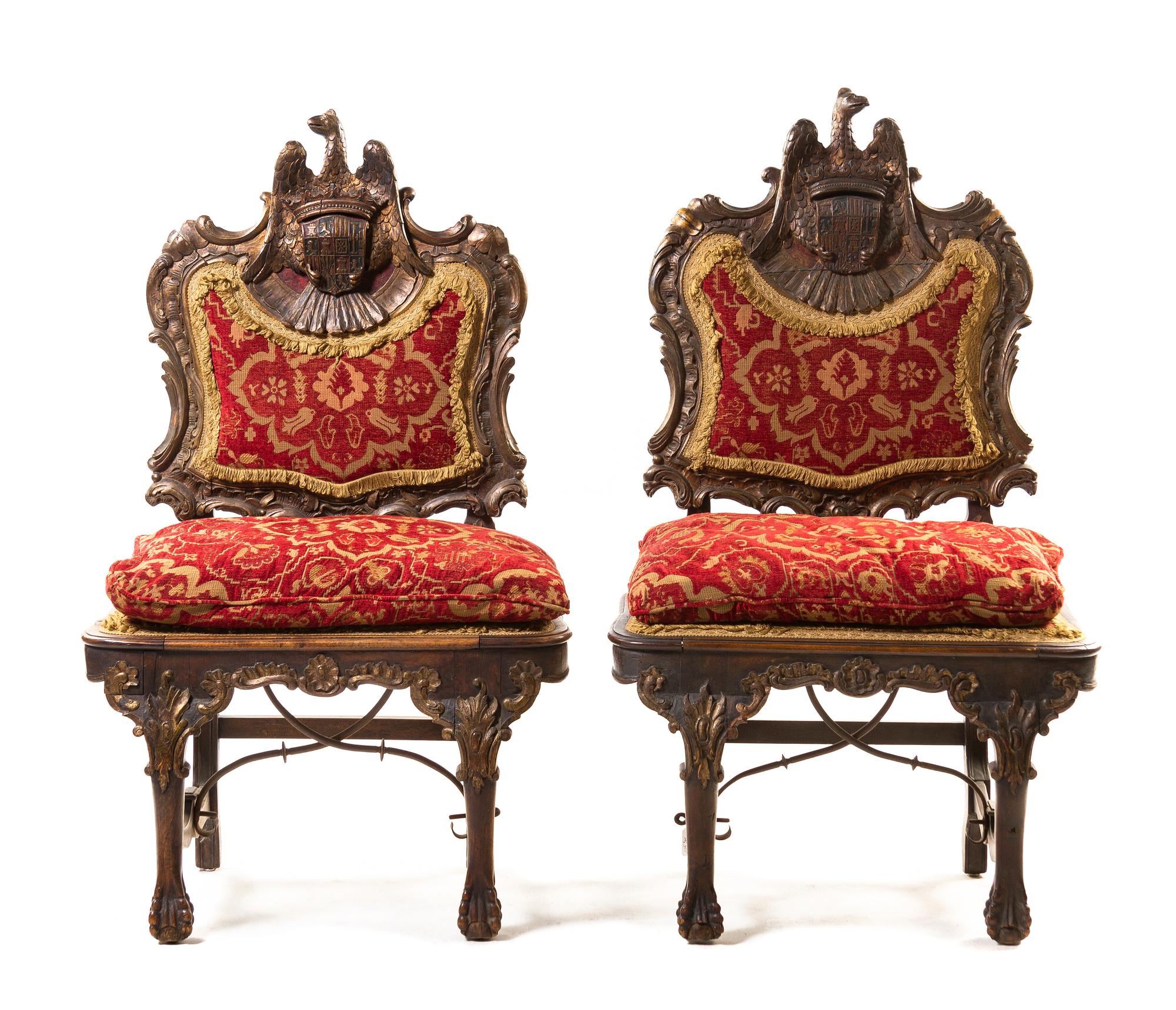 A Pair of Portuguese Carved and Parcel Giltwood Hall Chairs, Height 48 1/2 inches.
