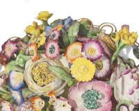 A large collection of seventeen Staffordshire figural groups and floral-form spill vases, late 18th and 19th century