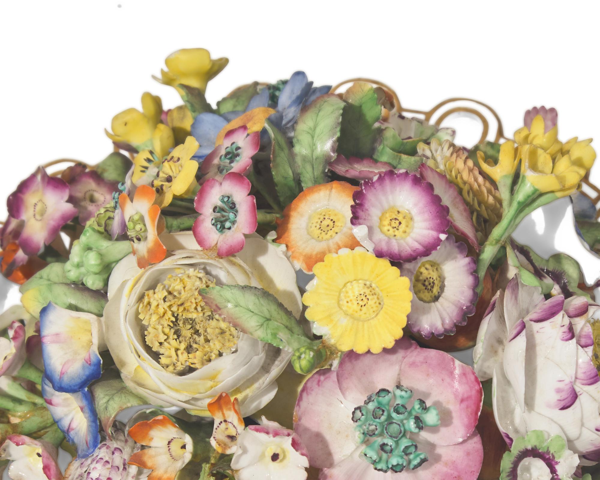 A large collection of seventeen Staffordshire figural groups and floral-form spill vases, late 18th and 19th century