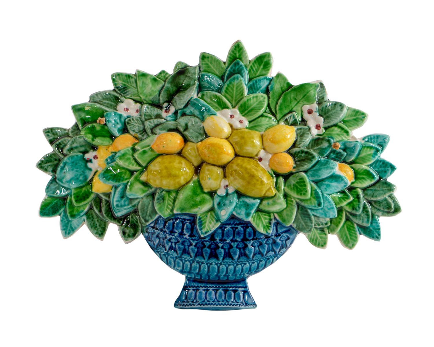A Glazed Ceramic Wall Plaque of a Basket of Fruit and Flowers — 20TH CENTURY
