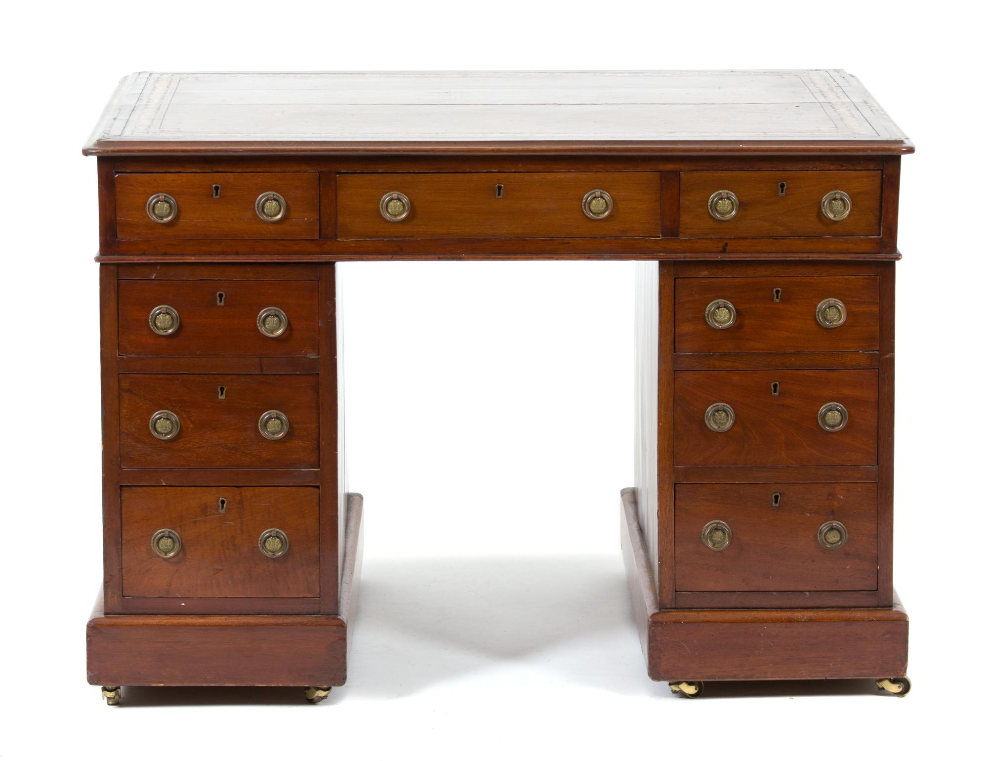 A George III Mahogany Pedestal Desk Height 28 1/2 x width 31 1/4 x depth 26 1/4 inches. — LATE 19TH/EARLY 20TH CENTURY
