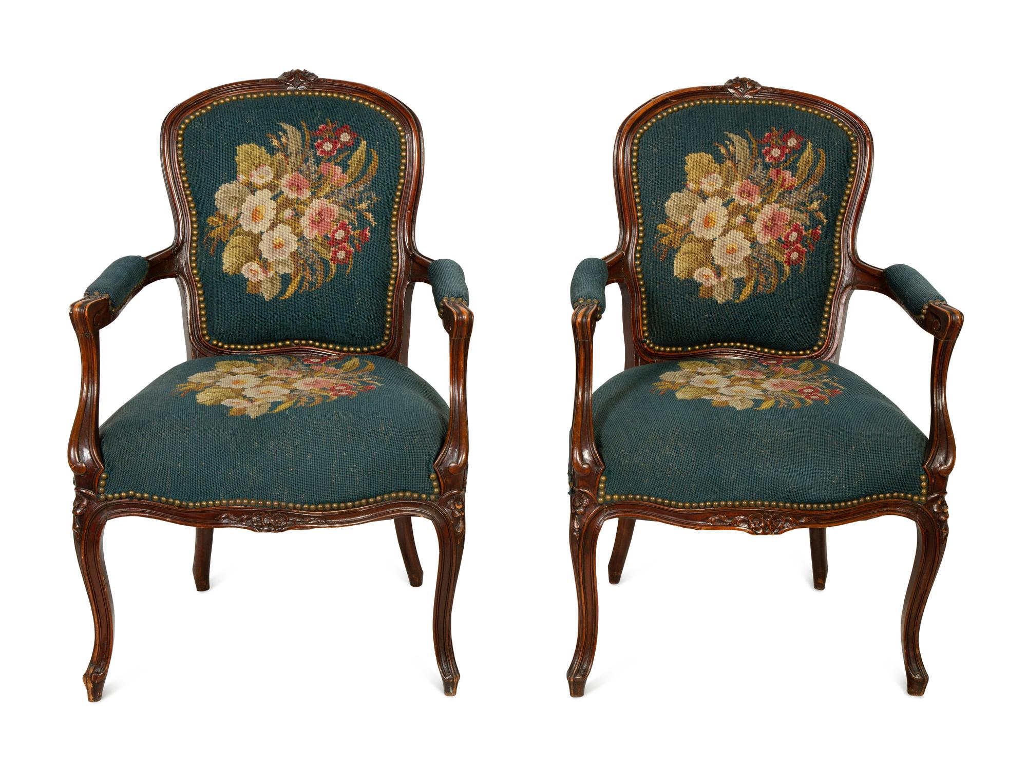 A Pair of Louis XV Style Walnut Fauteuils
