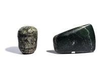 Two Near Eastern Stone Tools — An engraved macehead and axehead