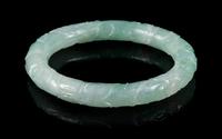 An Apple Green and Celadon Jadeite Bangle Interor diameter 2 1/4 inches.