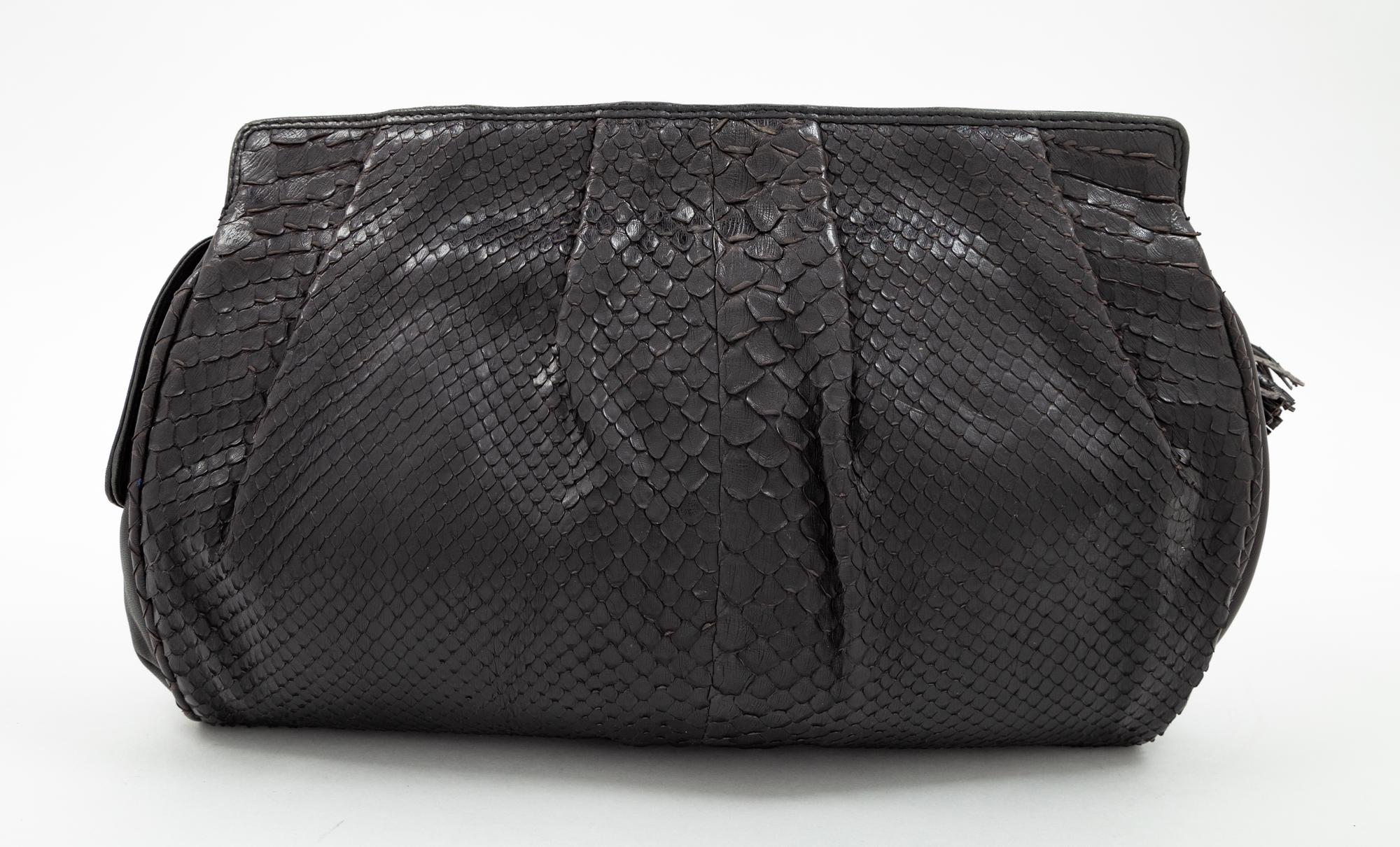 A Bottega Veneta Black Python Clutch, 8" H x 11.25" W x 1.5" D.