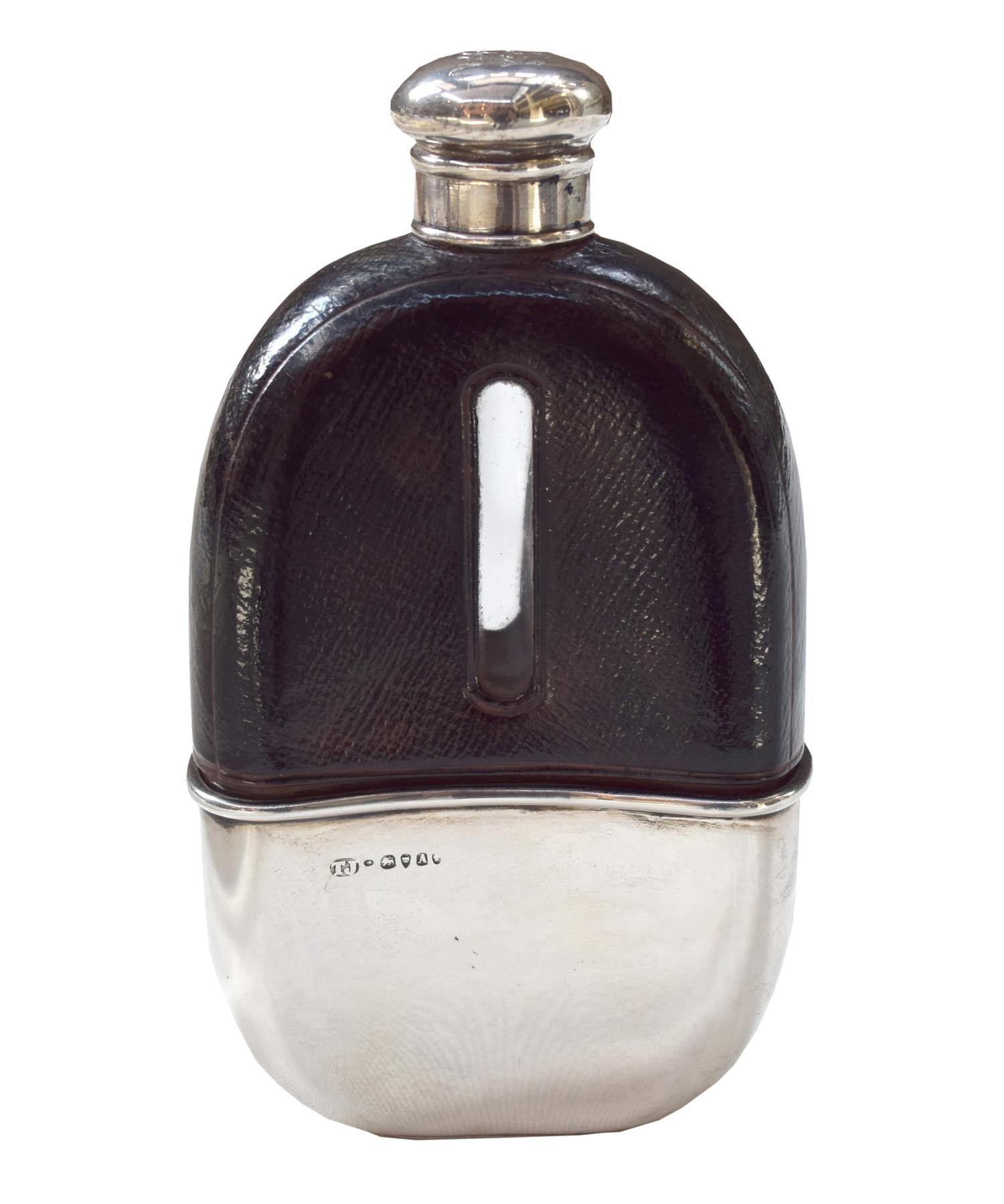A Silver and Leather Flask, Thomas Jenkins of London 3" W x 1" D x 5.25" H — England, Circa 1812