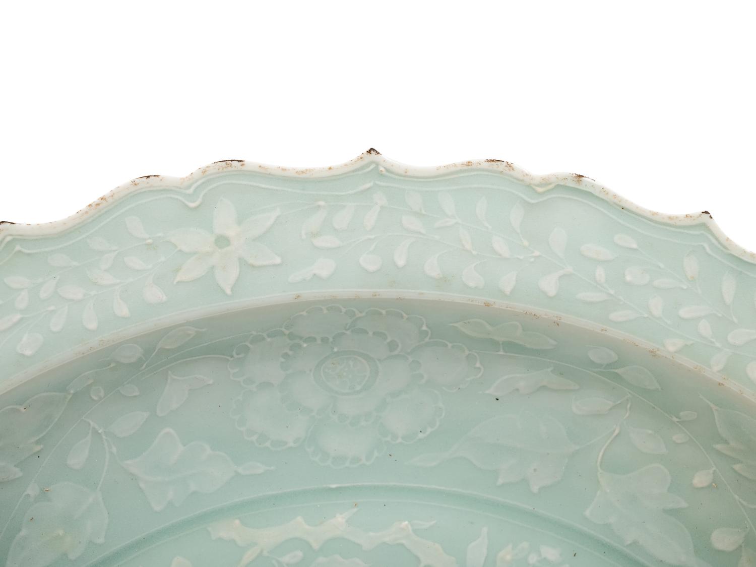 A Chinese Molded Celadon Glazed Porcelain Charger