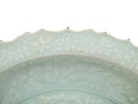 A Chinese Molded Celadon Glazed Porcelain Charger