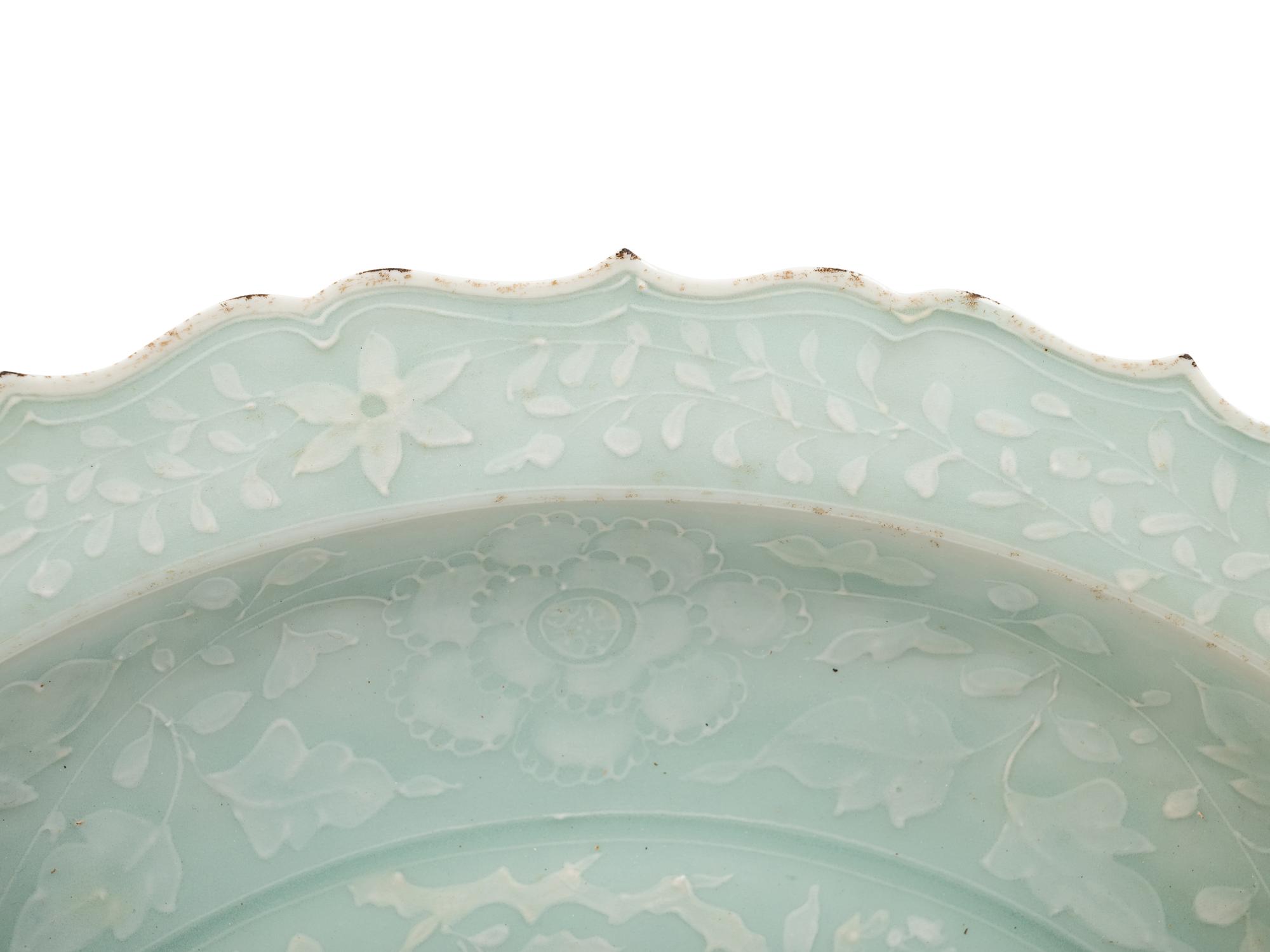 A Chinese Molded Celadon Glazed Porcelain Charger