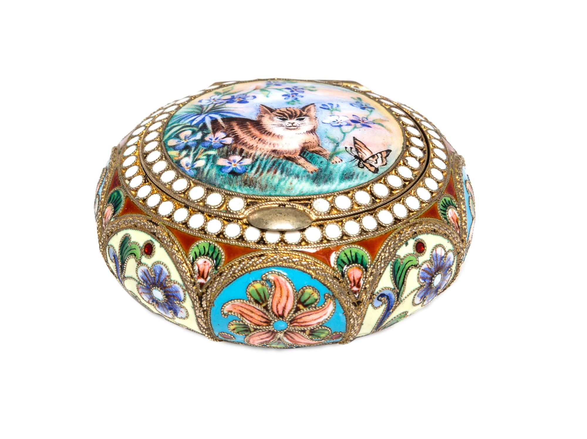 A Russian Enameled Silver Pill Box, Nikolai Alekseev, Moscow, 1896-1908, of circular form, the lid decorated with a kitten and butterfl
