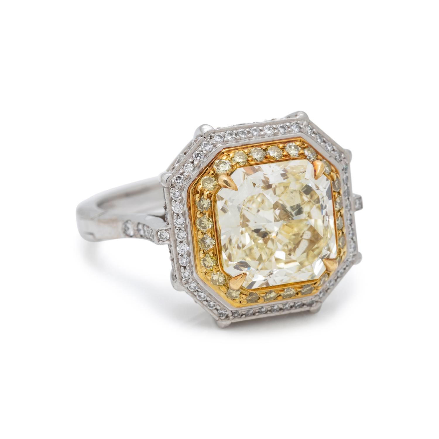 FANCY LIGHT YELLOW DIAMOND AND DIAMOND RING