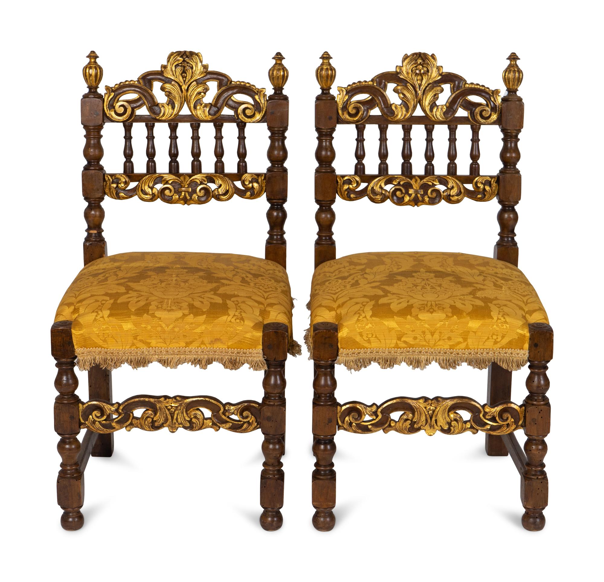 A Pair of Spanish Baroque Style Parcel-Gilt Walnut Slipper Chairs