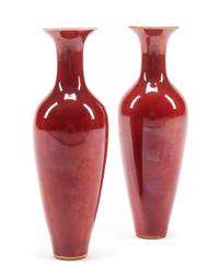 A Pair of Sang de Boeuf Porcelain Vases Height 9 1/2 inches.