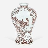 A Chinese carved and underglaze red "Dragons and Waves" vase, Meiping Yongzheng six-character mark and of the period