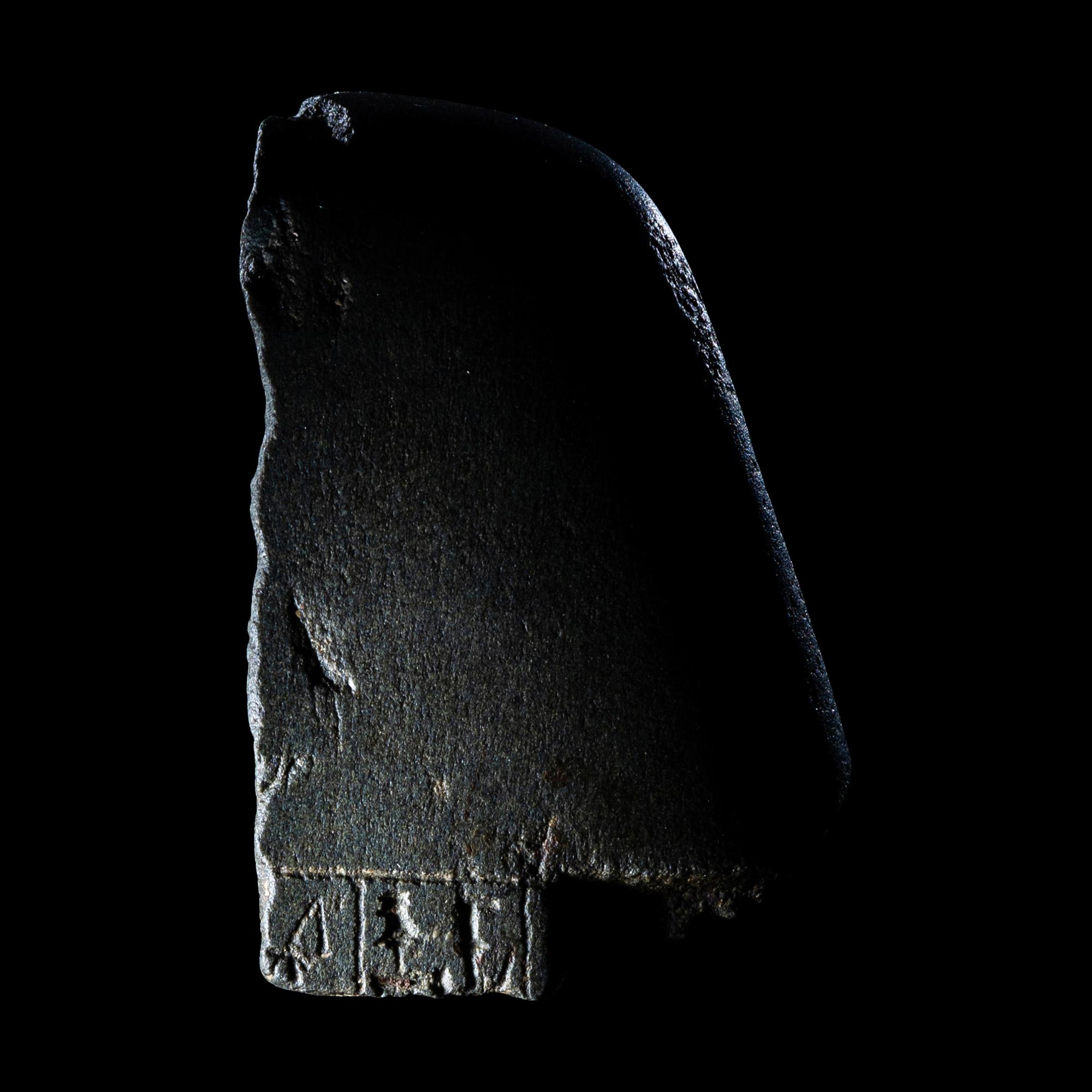 An Egyptian Schist Head of a Male