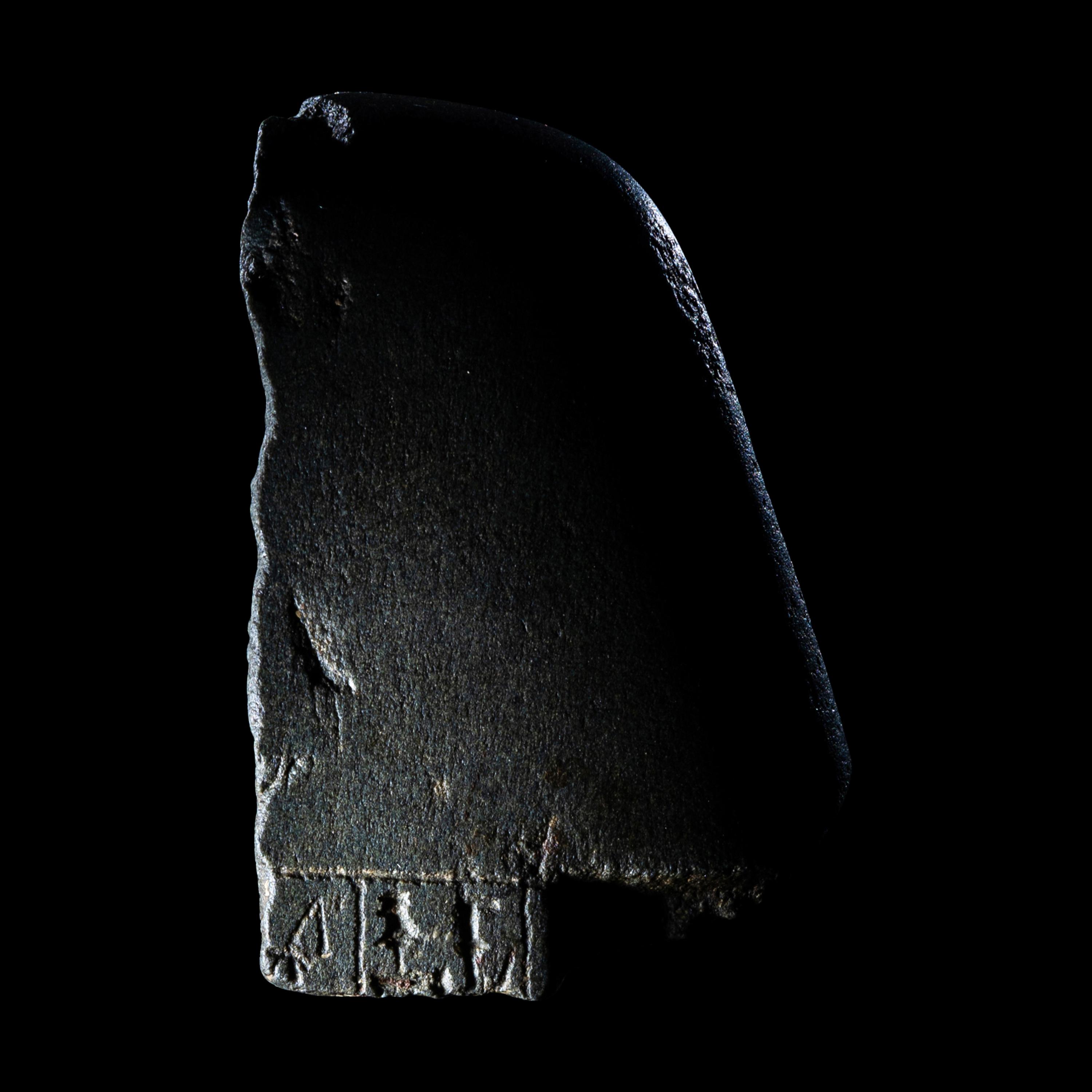 An Egyptian Schist Head of a Male