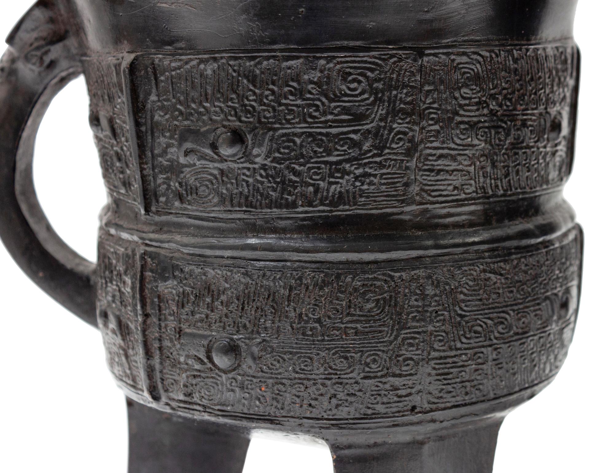 A Pair of Archaic Bronze Wine Vessels