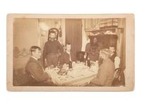 African Americana Boudoir card featuring a a group of white soldiers being served by an African American servant. Fort Sill, Oklahoma Territory.