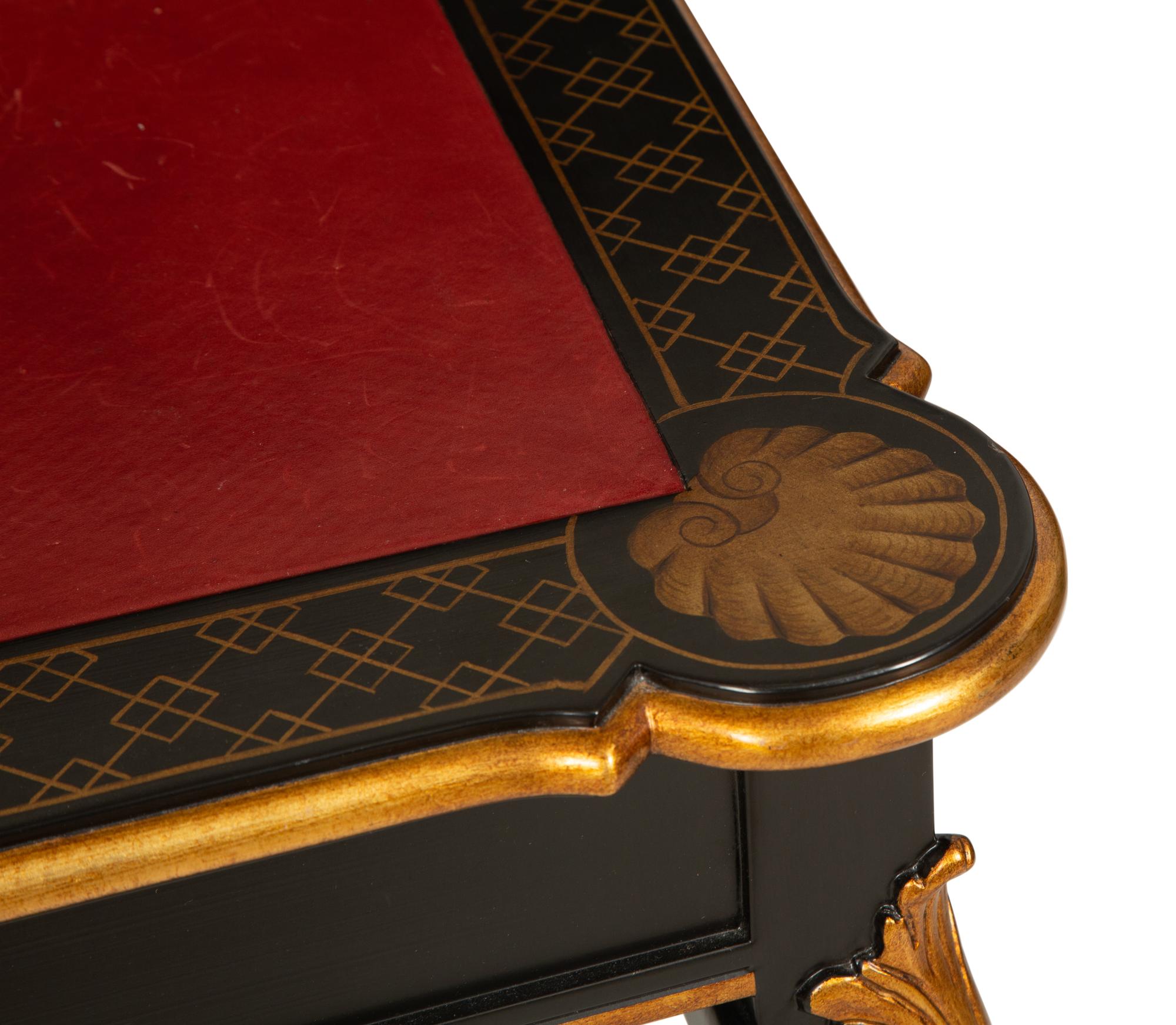 A Regency Style Black Lacquer and Parcel Gilt Card Table with Red Inset Leather Top