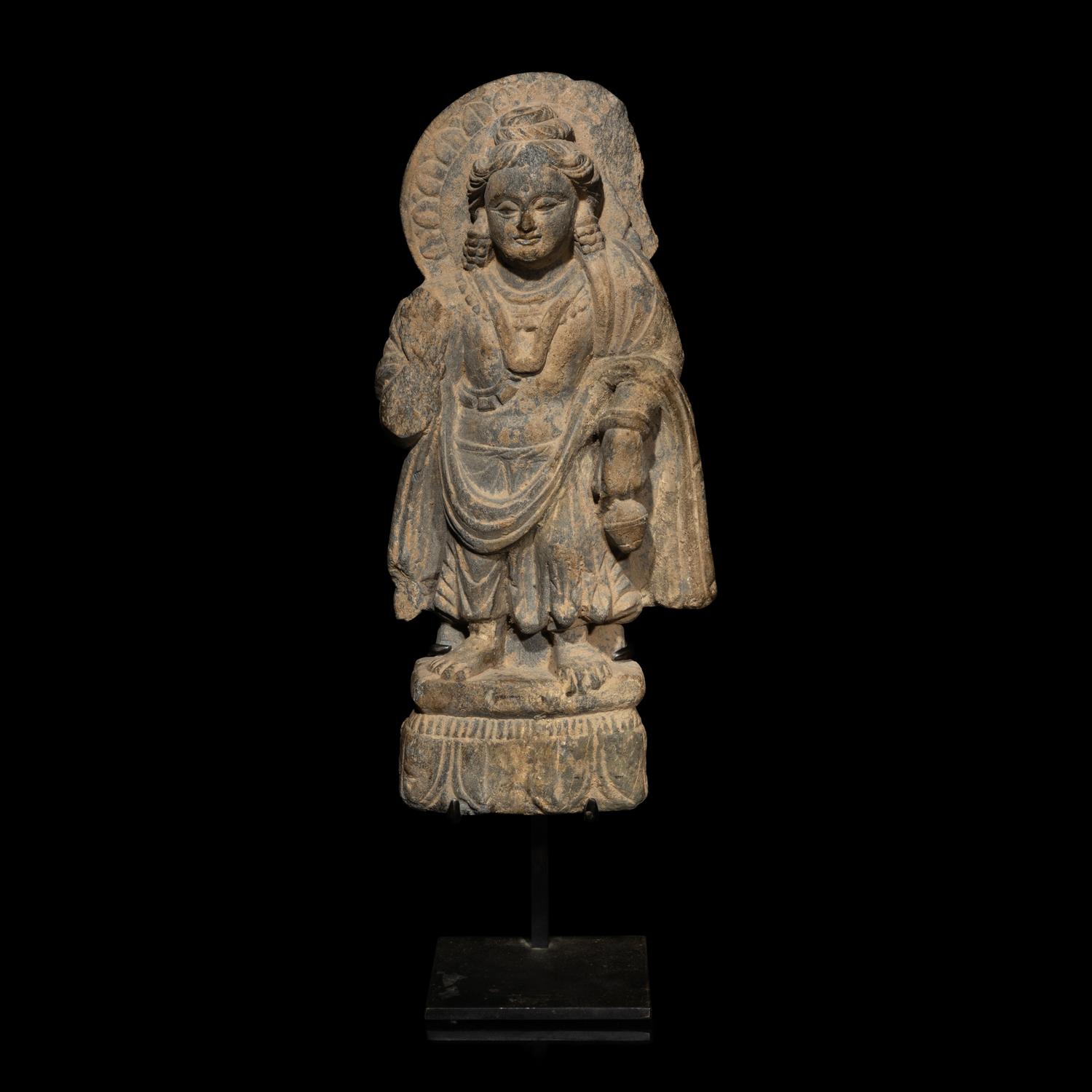 A Gandharan Grey Schist Standing Figure of Bodhisattva Maitraya, 3rd-5th Century