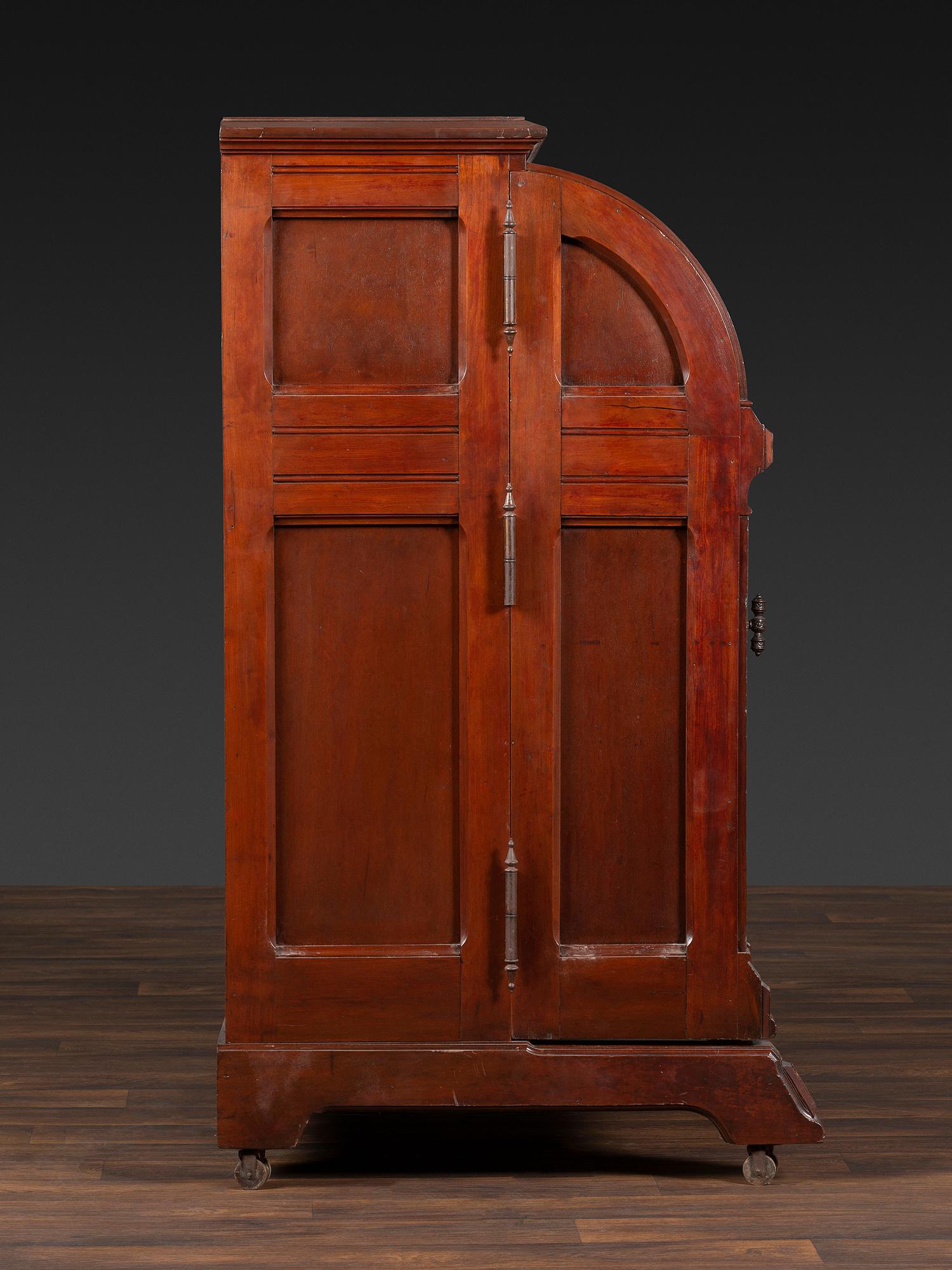 A Carved Walnut Wooton Secretary Desk
