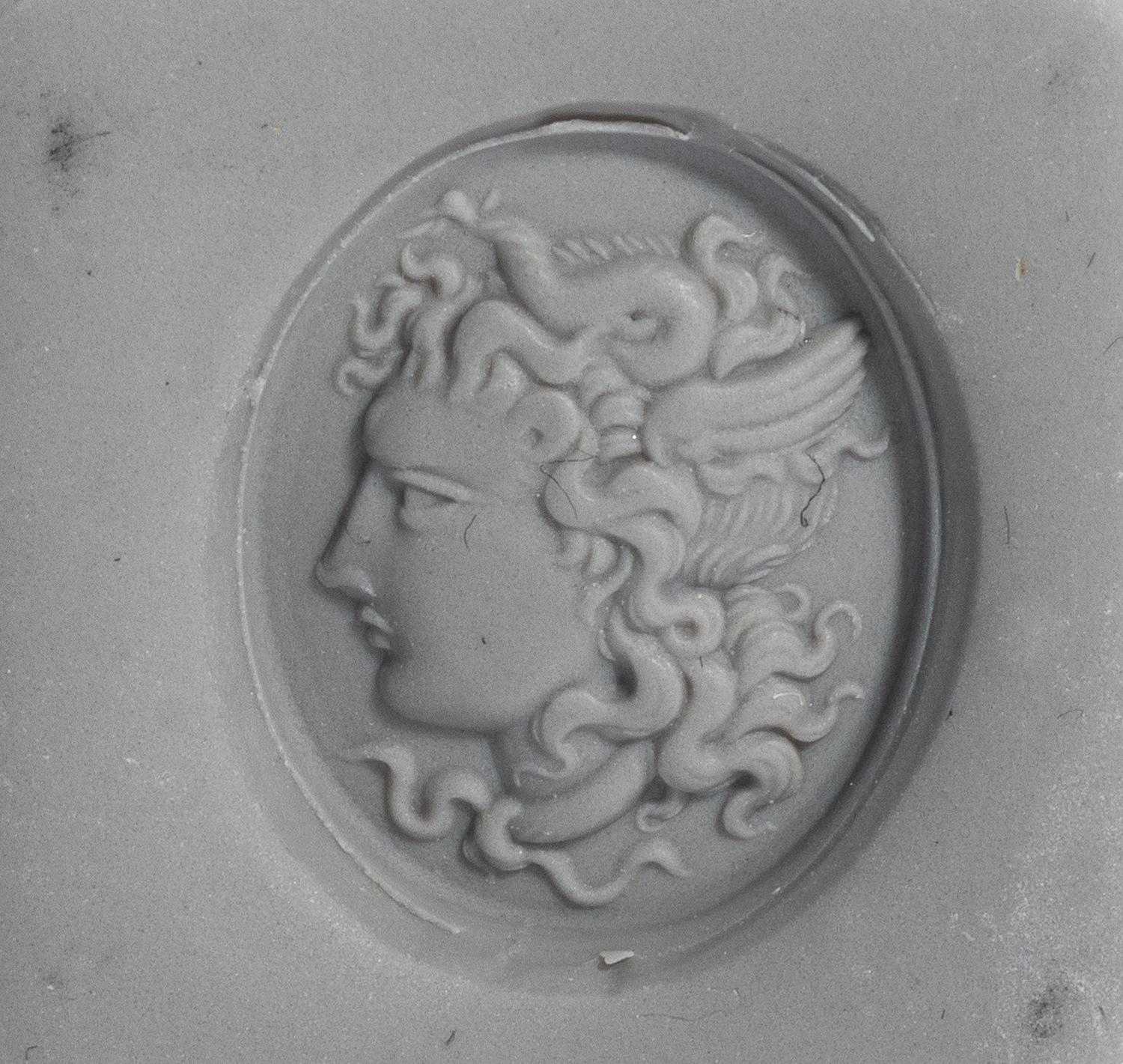 A Neoclassical Gold and Carnelian Finger Ring with a Head of Medusa