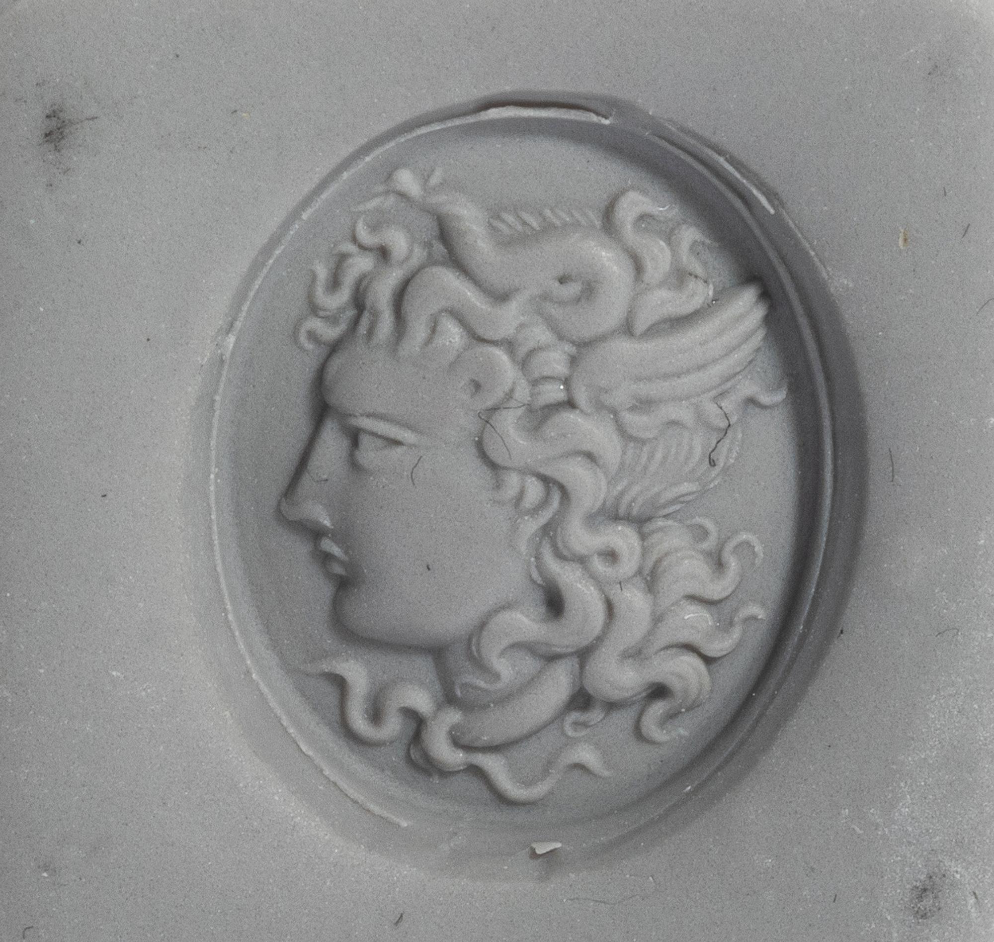 A Neoclassical Gold and Carnelian Finger Ring with a Head of Medusa