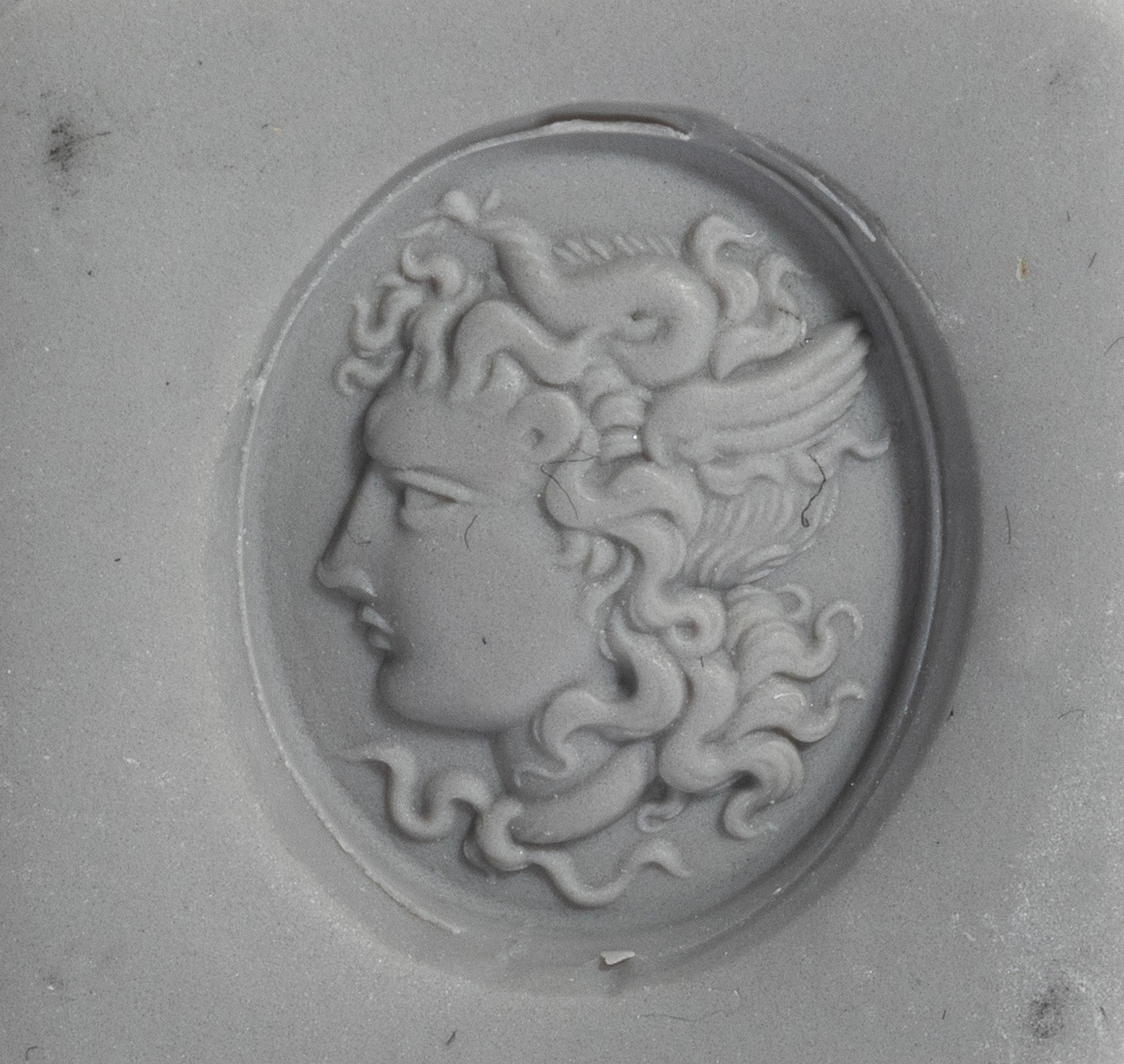 A Neoclassical Gold and Carnelian Finger Ring with a Head of Medusa
