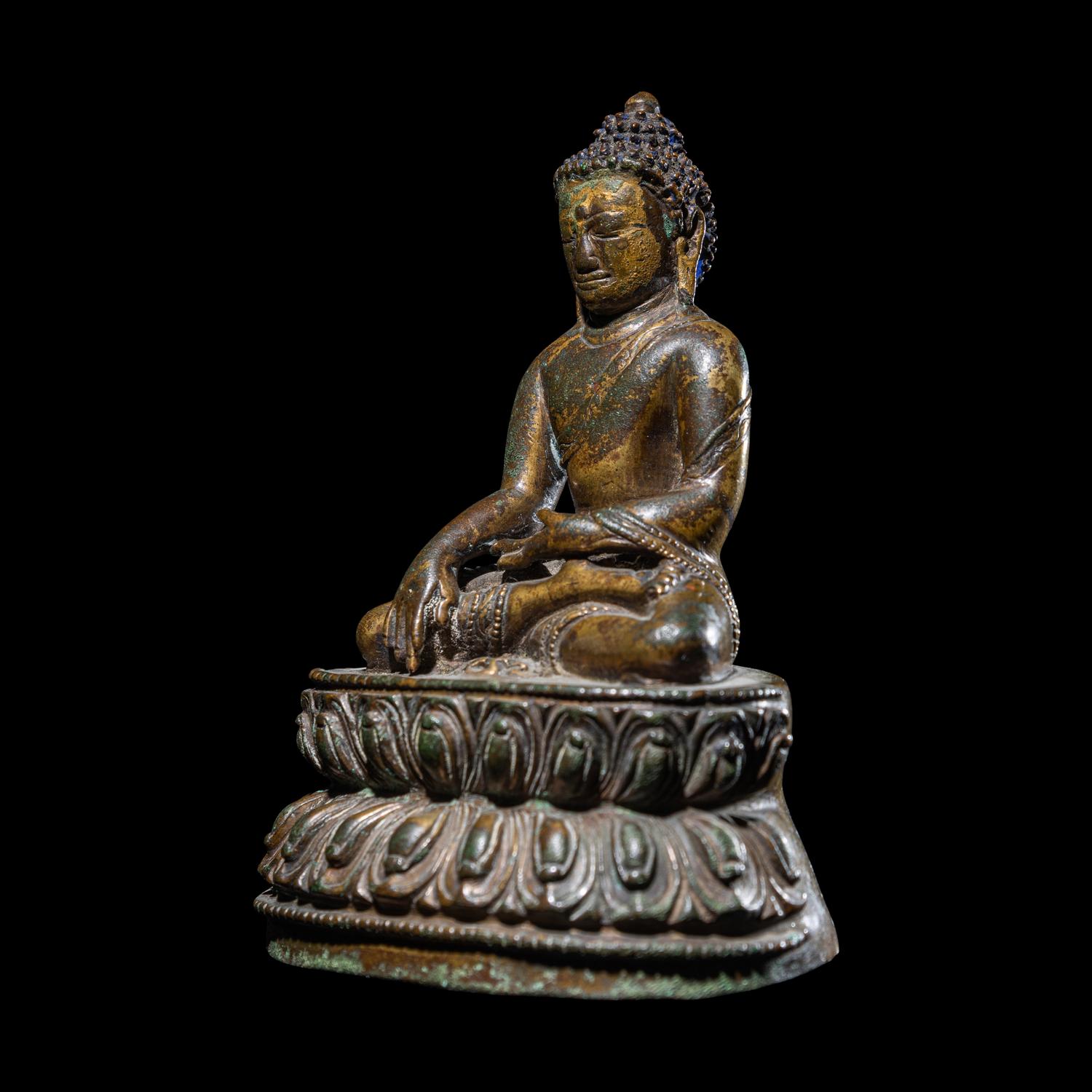 A Tibetan Gilt Copper Alloy Figure of Buddha Shakyamuni, 14th/15th Century 十四/十五世紀 西藏銅鎏金坐佛