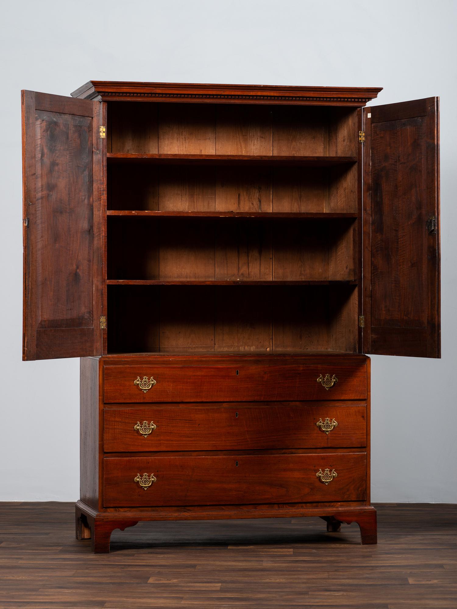 A Chippendale Figured Mahogany Linen Press