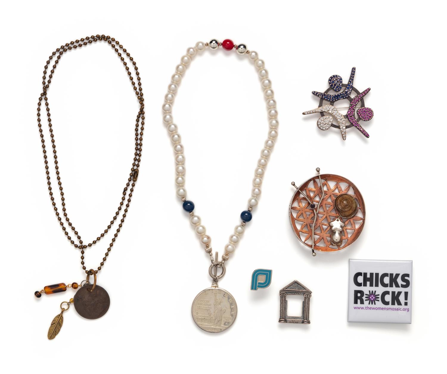 COLLECTION OF SEVEN PATRIOTIC AND FEMINISM THEMED JEWELRY ITEMS