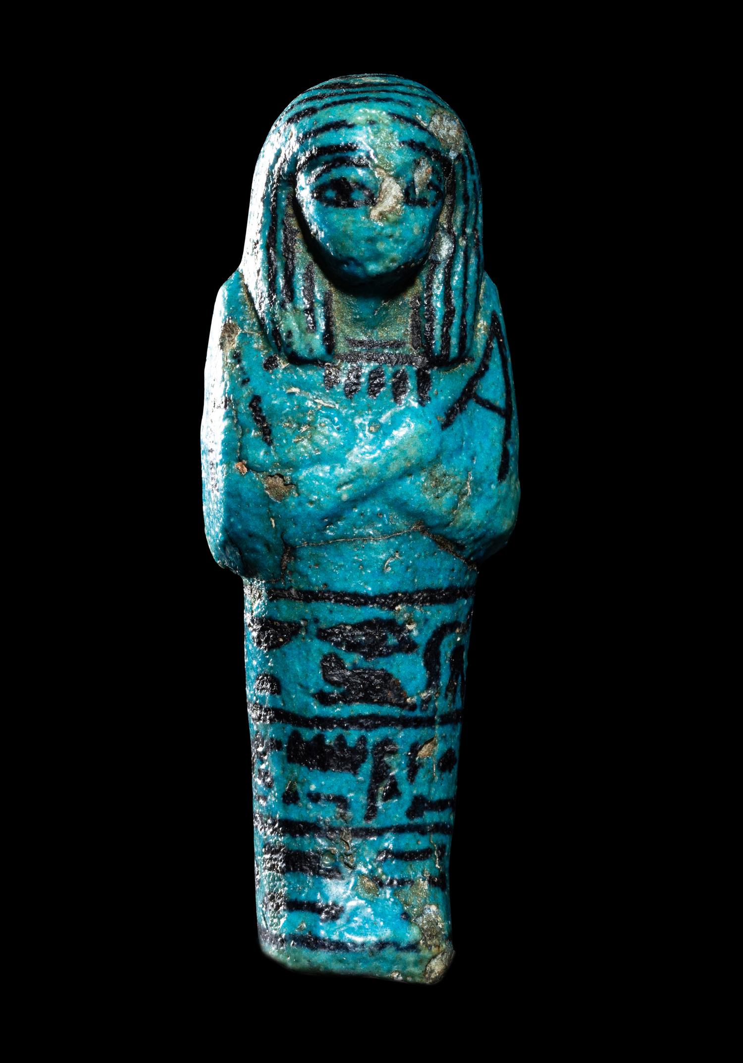 An Egyptian Blue Faience Ushabti for the Mistress of the House and Chantress of Amun, Muthotep