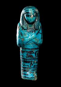 An Egyptian Blue Faience Ushabti for the Mistress of the House and Chantress of Amun, Muthotep