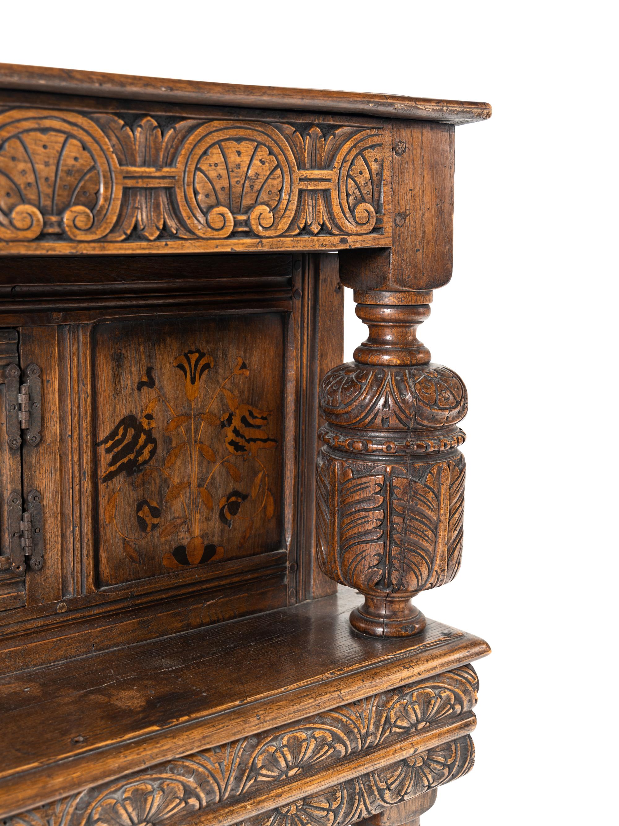 A Jacobean Style Oak and Marquetry Court Cupboard