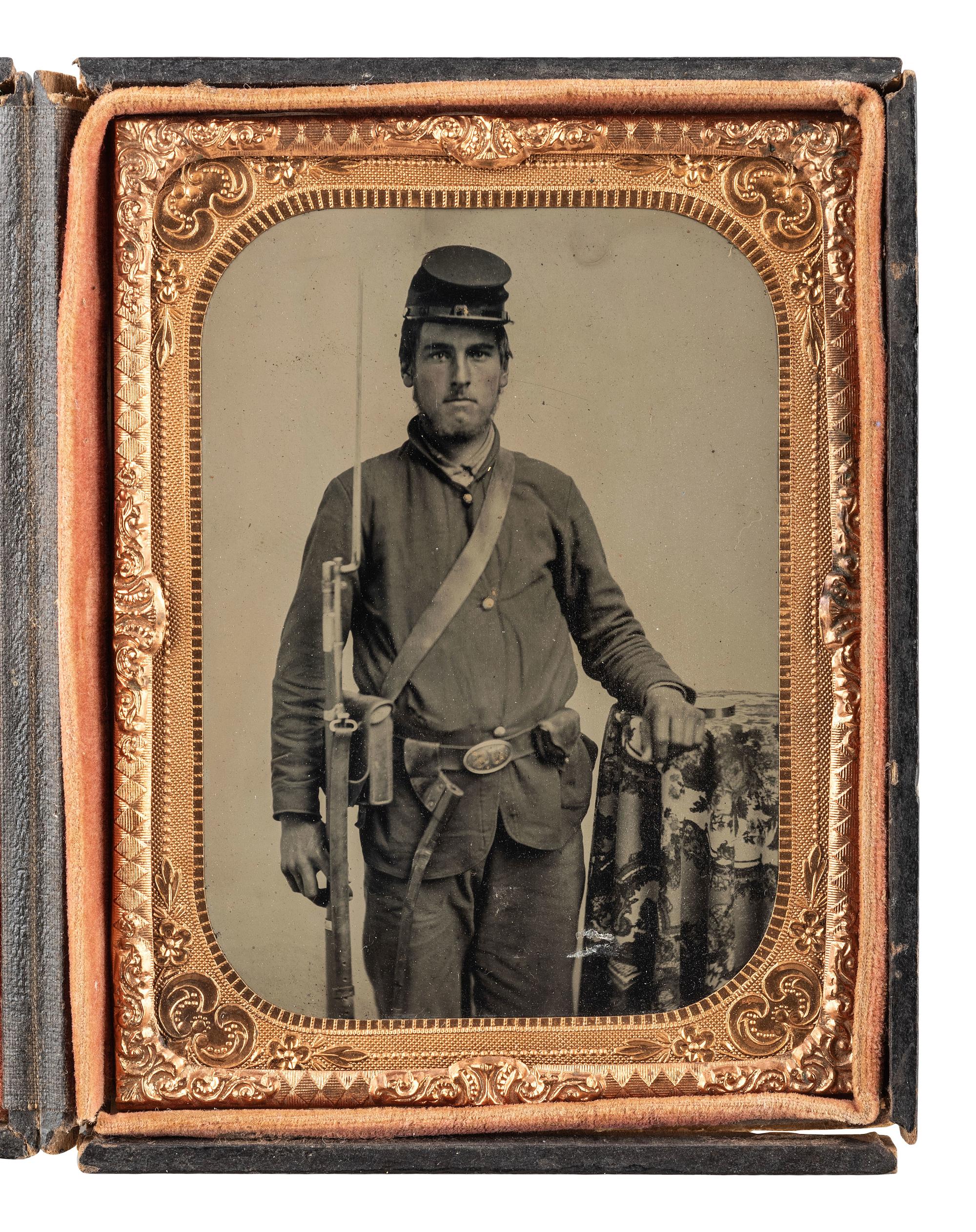 [CIVIL WAR]. Quarter plate tintype portrait attributed as David Kiplinger, Co. K, 102nd Ohio Infantry Regiment, accompanied by ladder badge, CDV, and RPPC.