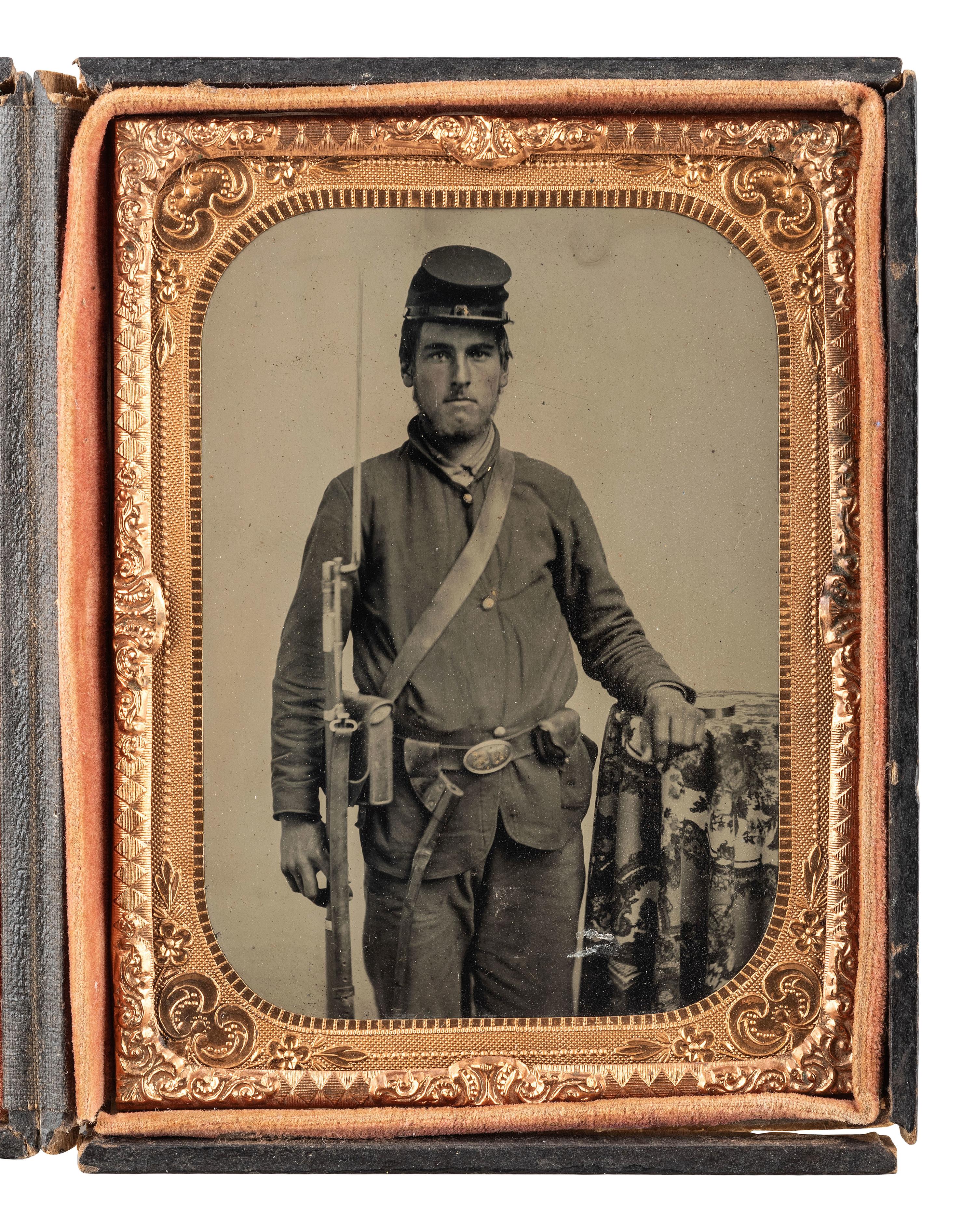 [CIVIL WAR]. Quarter plate tintype portrait attributed as David Kiplinger, Co. K, 102nd Ohio Infantry Regiment, accompanied by ladder badge, CDV, and RPPC.