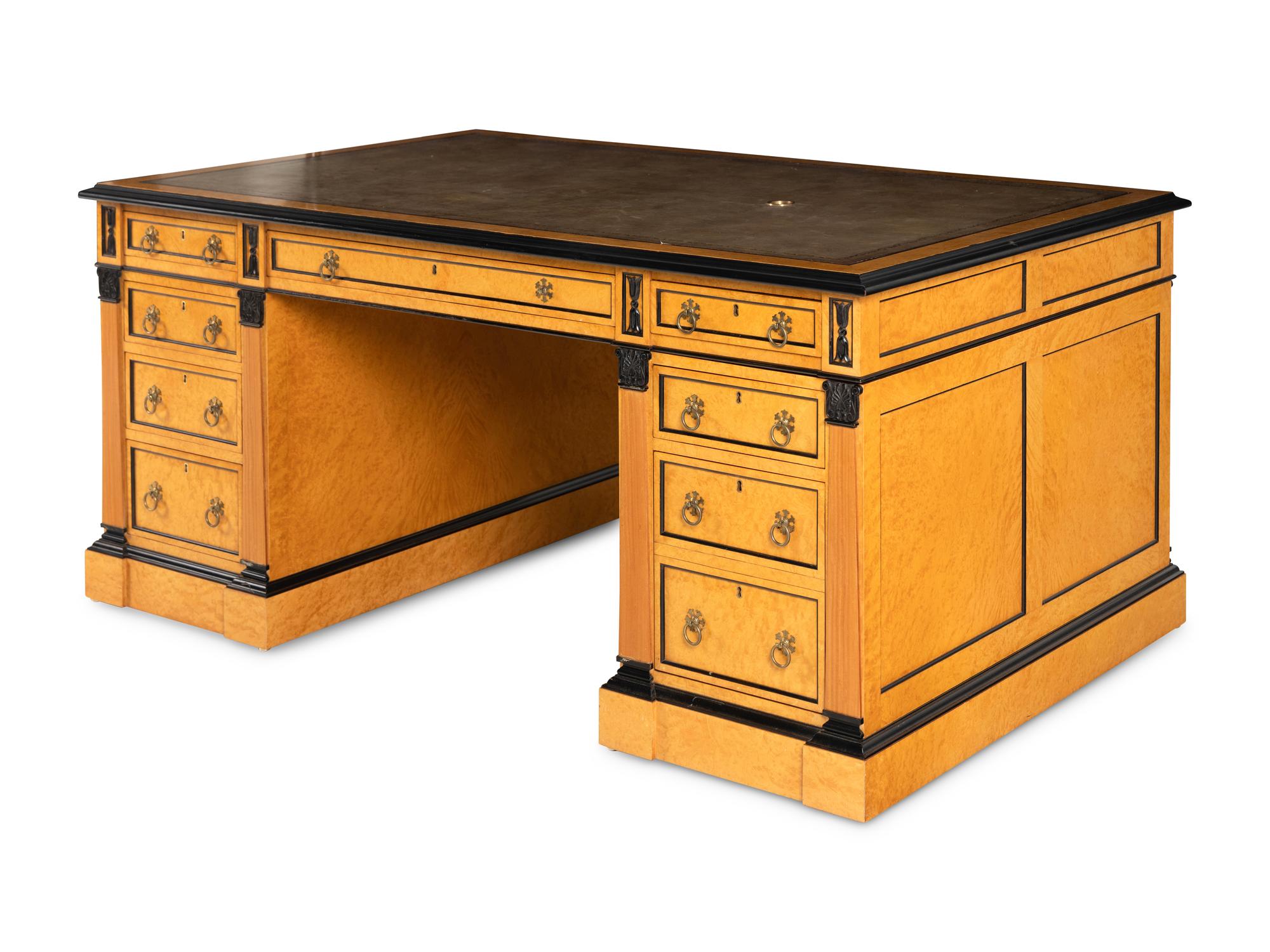 A Russian Neoclassical Style Birch and Parcel Ebonized Partner's Desk