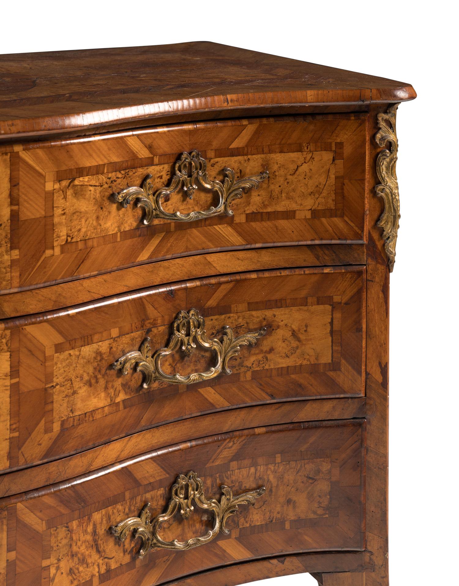A Continental Gilt Bronze Mounted Burlwood Serpentine Commode