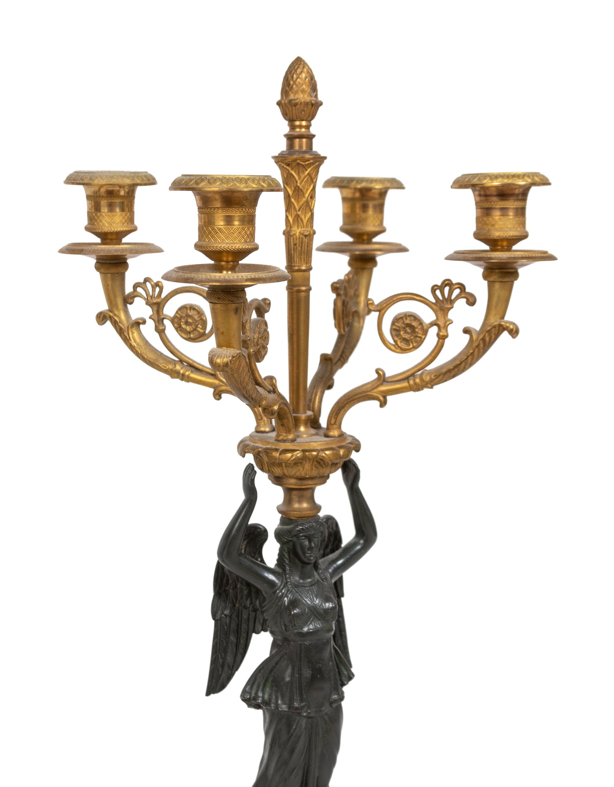 A Pair of Empire Style Parcel-Gilt and Patinated Bronze Four-Light Candelabra