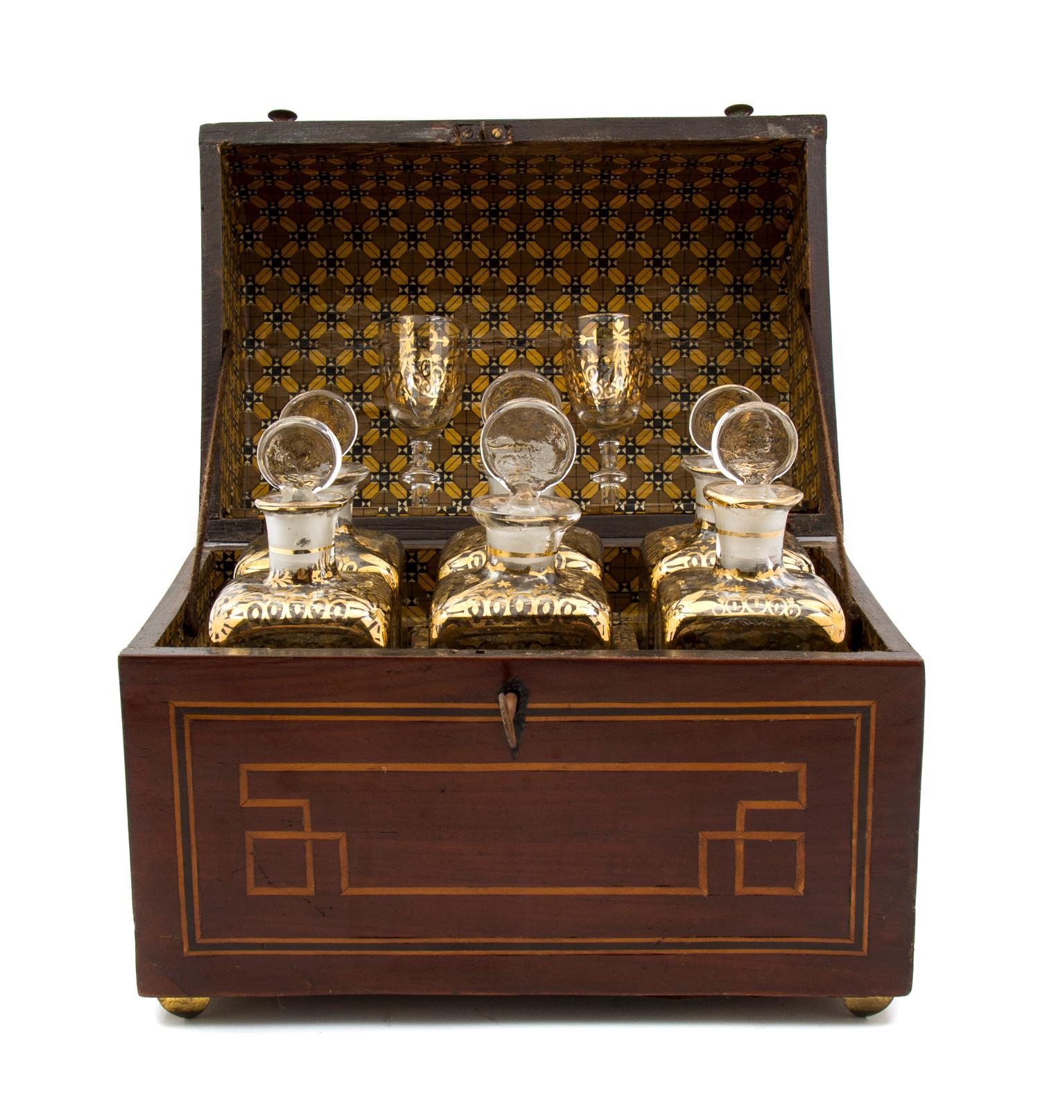 A Dutch Mahogany Inlaid Decanter Set, Height of case 9 1/4 x width 11 3/4 x depth 7 1/2 inches.