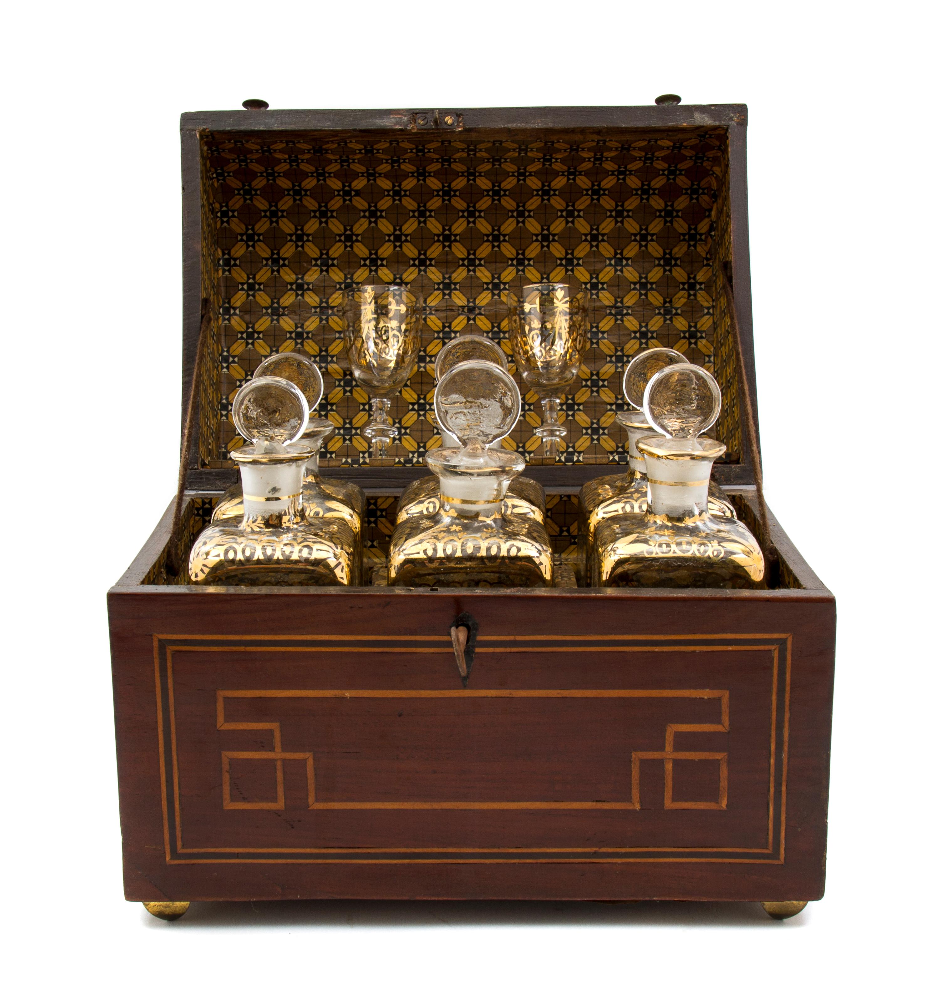 A Dutch Mahogany Inlaid Decanter Set, Height of case 9 1/4 x width 11 3/4 x depth 7 1/2 inches.