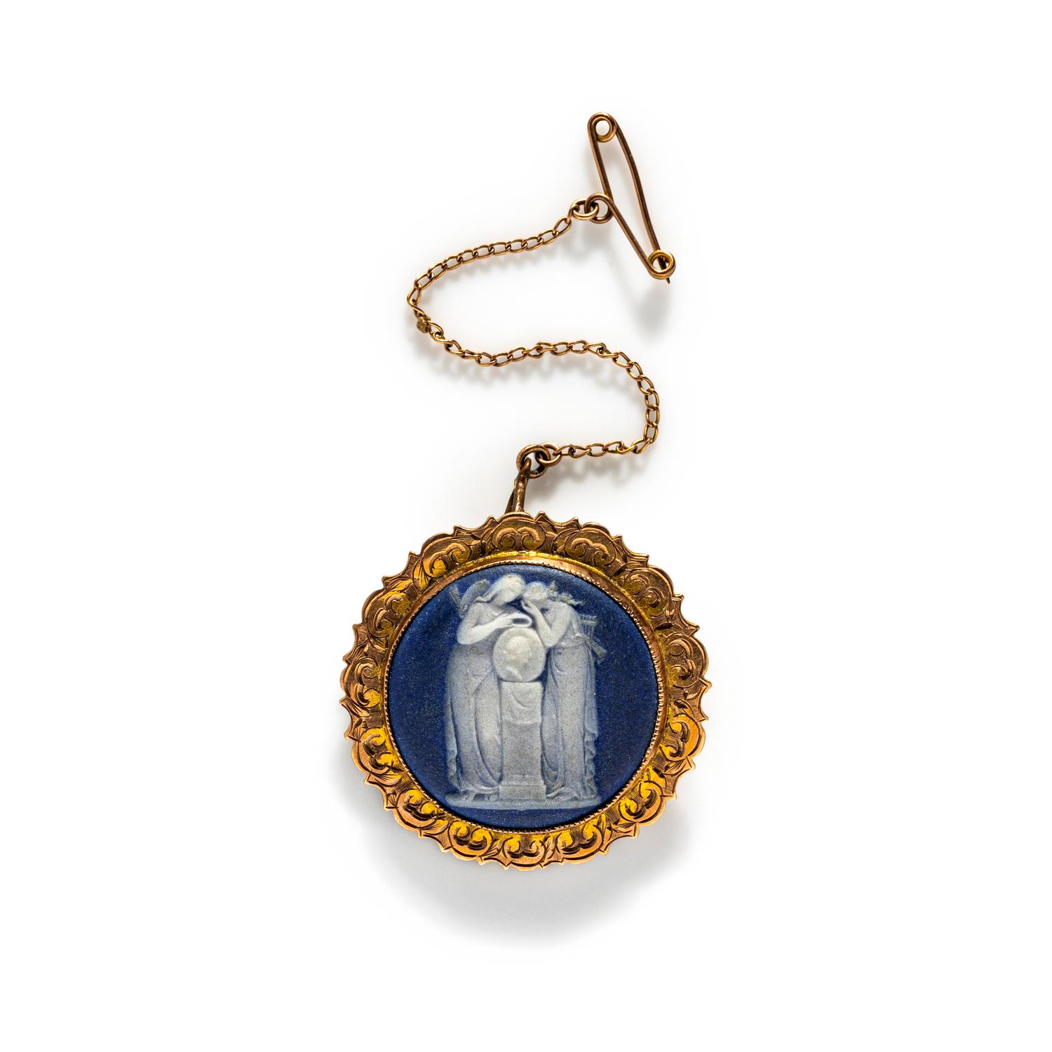 A Neoclassical Gold and Cameo Brooch with a Mourning Goddess