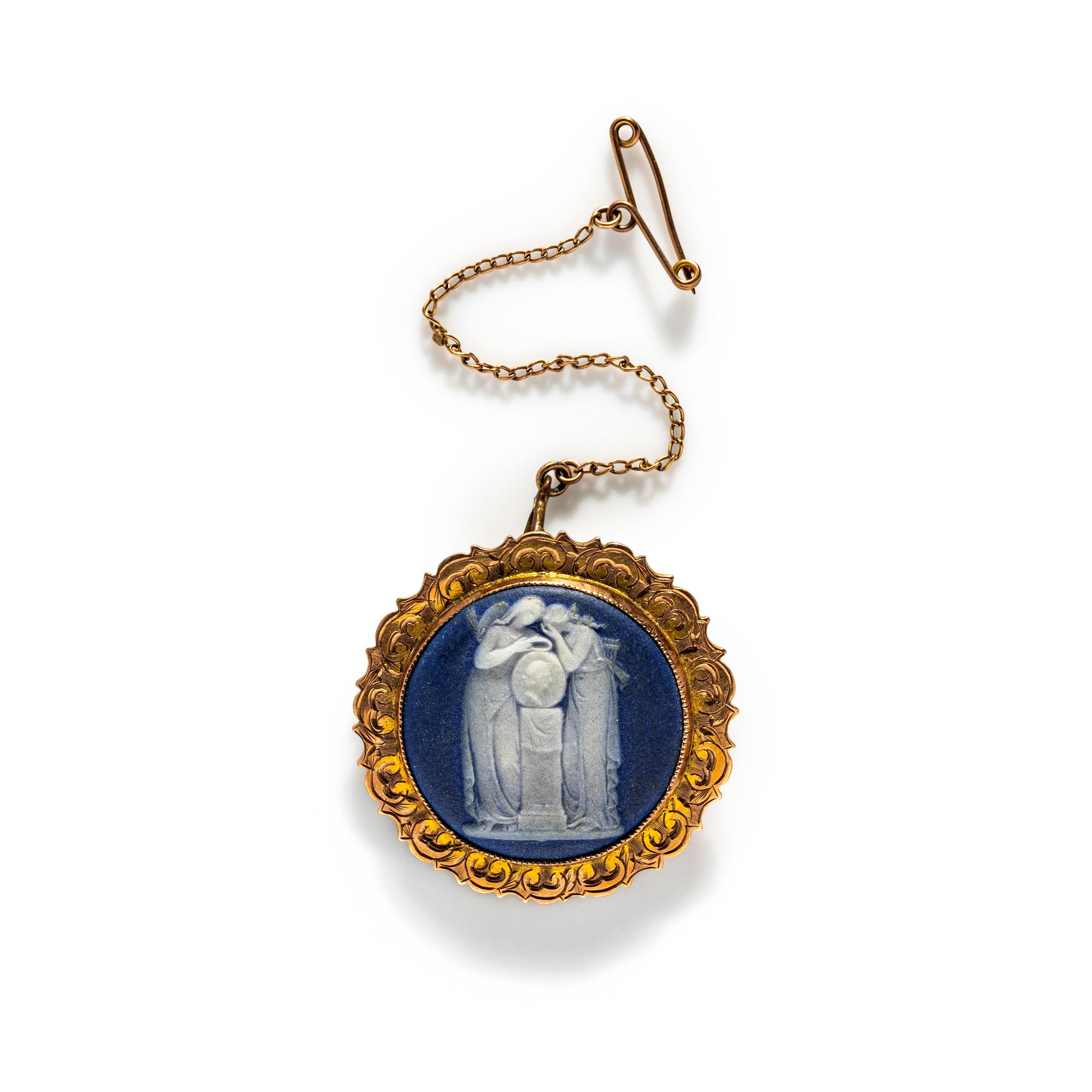 A Neoclassical Gold and Cameo Brooch with a Mourning Goddess