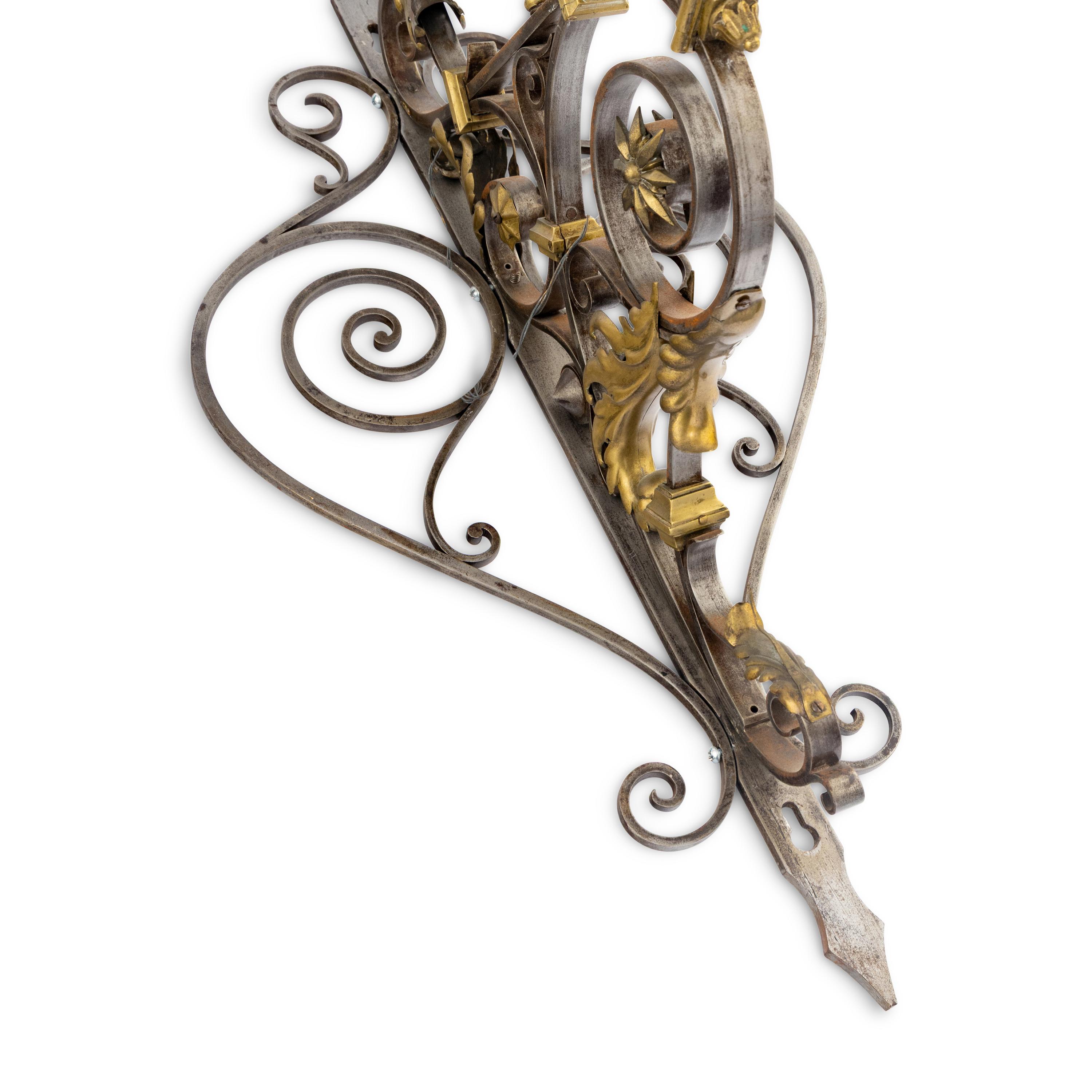 A Pair of Brass and Steel Wall Brackets