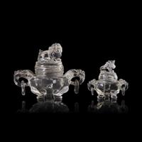 A Small Chinese Rock Crystal Tripod Covered Censer and A Glass Covered Censer, 20th Century 近代 雕水晶和料器獅鈕三足爐各一