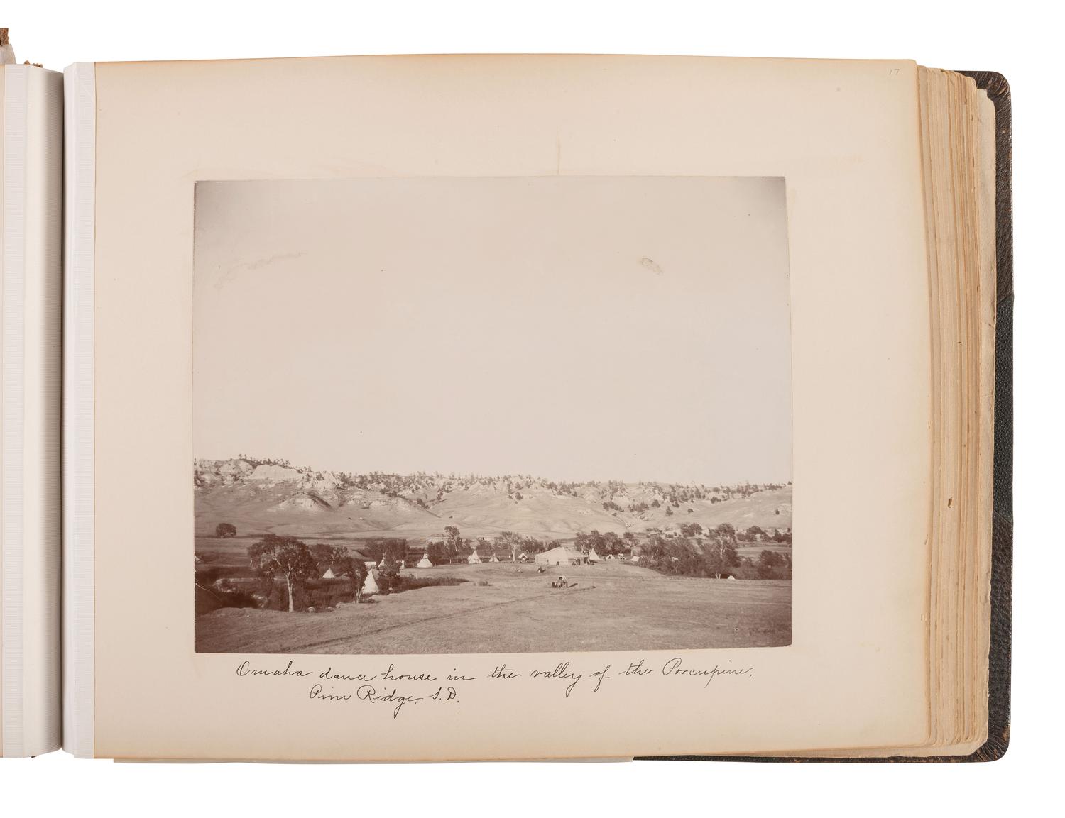 Exceptional album containing photographs of Pine Ridge Reservation and its surroundings, incl. Native American subjects, Indian schools, ceremonies, camp life, and Wounded Knee. Ca late 1890s-early 1900s.