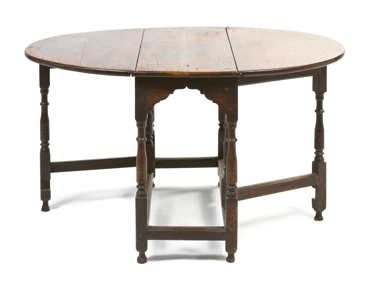A William and Mary Style Oak Gate-Leg Table, Height 27 3/8 x width 36 1/4 x depth 16 inches.