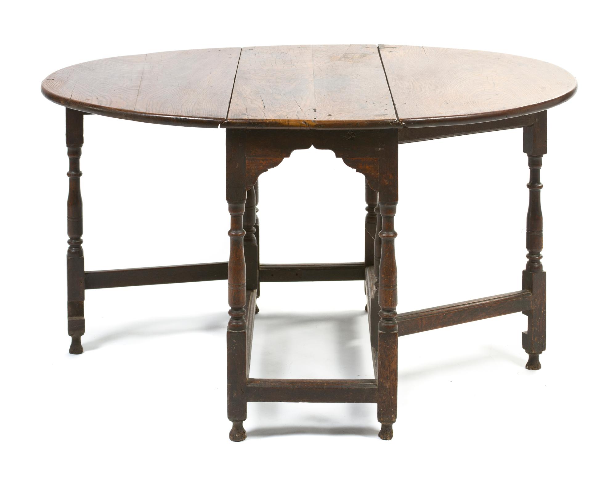 A William and Mary Style Oak Gate-Leg Table, Height 27 3/8 x width 36 1/4 x depth 16 inches.