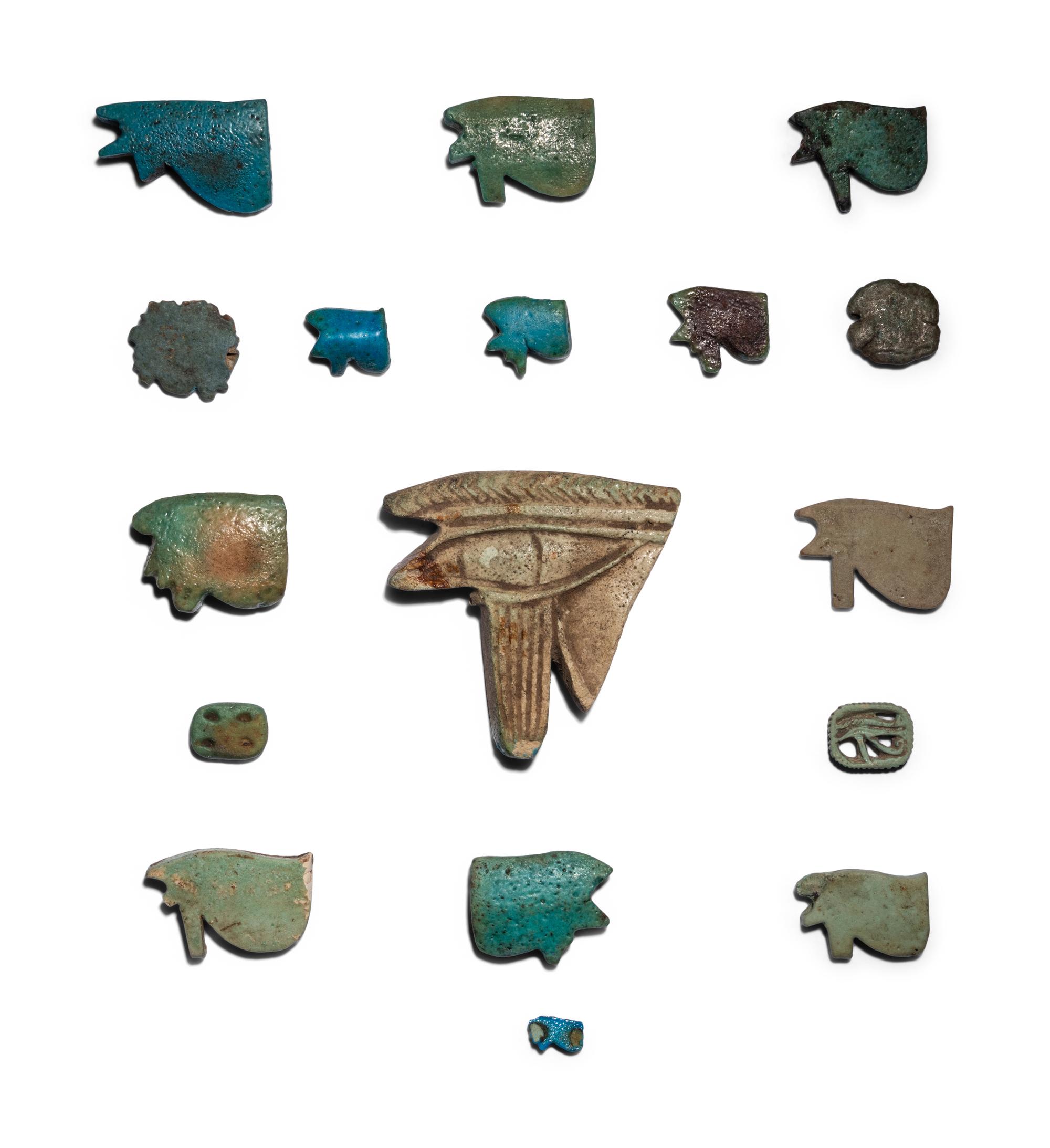 Seventeen Egyptian Faience Wadjet Eyes